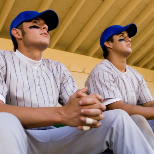 Players sitting in the dugout